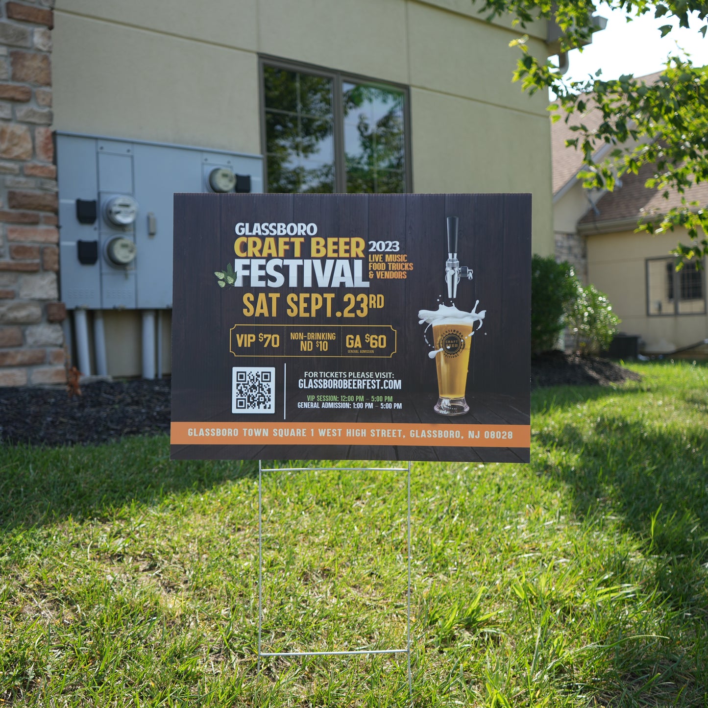 A lawn sign for the Glassboro Craft Beer on metal stakes