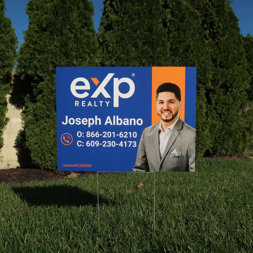 Real estate agent lawn sign for EXP Realty on metal stakes